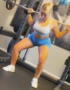 Small blonde pawg in light blue pants squatting as low as she can. Frontal view. OC