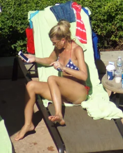 Blonde babe at the pool with sexy body in USA bikini