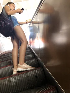 Girl in Mini Shorts with Awesome Legs on the Subway Escalator Creepshots