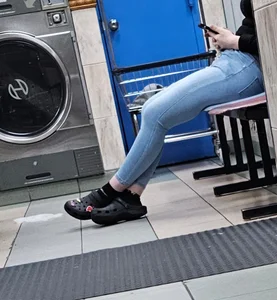 Hot latina in tight jeans at the laundromat