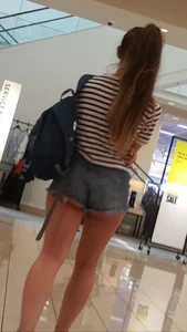 OC! Super cute brunette in jean short shorts with cheeks out and bikini tan lines up escalator! OC!