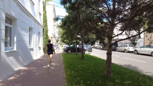 Cute candid girl in shorts walking down the street street video