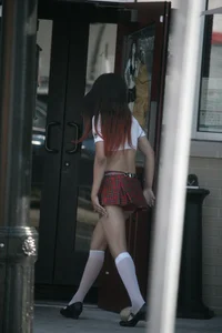 Two sexy Tilted Kilt employees showing cleavage and cheeks