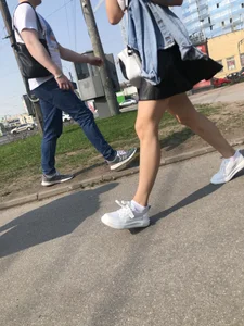 Awesome Candid Girl in a Leather Skirt And Sneakers Walking Down a Street, Then Flashing Her White Panties on the Stairs Creepshots Gallery