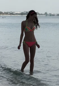 Two candid skinny teen sisters in bikinis