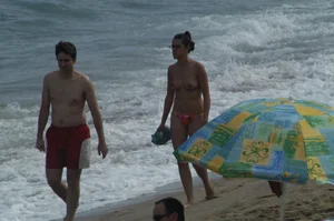 Topless girls on a beach in Barcelona