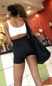 hot petite Indian chick showing some T&A in skimpy workout clothes