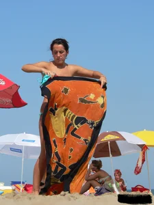 2 topless thonged sexy friends on the beach with great bodies