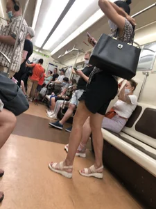 Candid Girl With Hot Long Legs in Shorts And Sandals Subway Train Creepshots Gallery