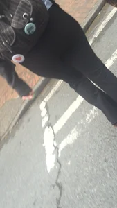 Girl with a nice ass in leggings walking down the street