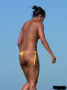 Bunch of sexy babes on the beach topless and in thong bikinis