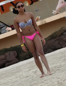 Sexy black girl in bikini and short shorts with a cute friend with braces