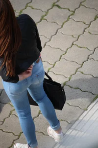 Pretty redhead in tight jeans with a nice booty