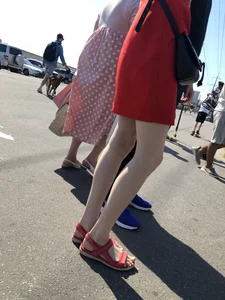 Girl in a Red Dress and Sandals With Thin, Pale Legs on the Crosswalk City Creepshots Gallery