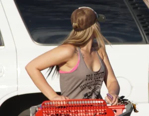 Hot blonde after shopping in short jean shorts and tank top