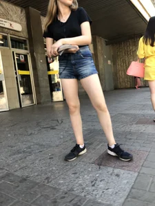 Cute Girl Distributing Leaflets in Shorts City Candid Gallery