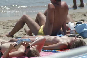 Girls on a nude beach in Sitges, Spain