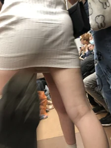 Group of Teens in Short Dresses in a Subway Train and on an Escalator Gallery