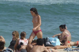 Topless girls on a beach in Barcelona