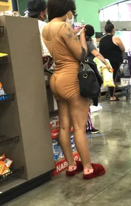 Latina with hard nipples and a big booty in tight spandex shorts outfit
