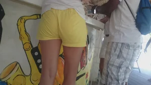 Milf in yellow shorts with vpl and a wedgie
