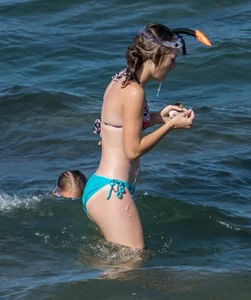 Another sexy girl on the beach snorkeling