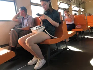 Amazing Hot Girl Sitting in the Train in Shorts Showing Off Her Gorgeous Legs Candid Gallery