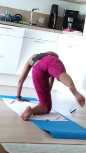 Sexy girlfriend doing yoga at home in leggings