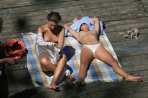 Two teens stripping and going topless to tan