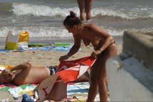 Girls on a nude beach in Sitges, Spain