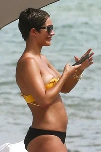 Frankie Bridge nip slips in a bikini on the beach
