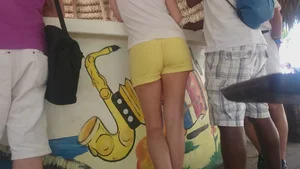 Milf in yellow shorts with vpl and a wedgie