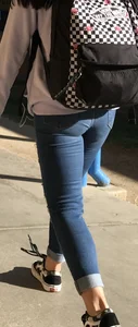 Flat Booty in Blue Jeans, Girl With Backpack on the Street