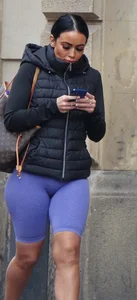 Wide hipped, juicy fronted tanned brunette pawg struts in lycra shorts