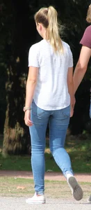 Blonde chick walking with her boyfriend in tight jeans