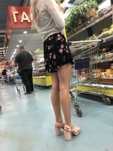 Girl With Amazing Legs on Hight Heeled Sandals at the Supermarket Closeup Photos