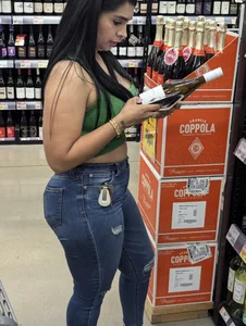 Sexy Latina buying wine