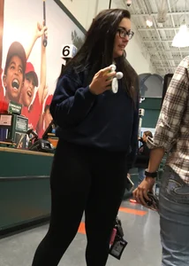 Brunette with glasses and big booty in leggings at Dicks
