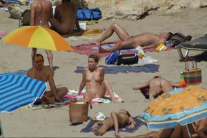 Girls on a nude beach in Sitges, Spain