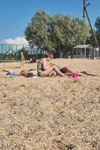 Blonde milf in blue thong bikini