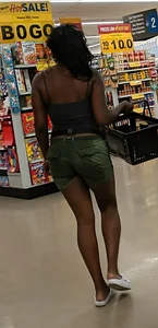 Ebony chick grocery shopping in green shorts