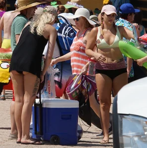 Girls in bikinis getting ready for tubing