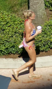 Blonde babe at the pool with sexy body in USA bikini