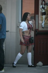 Two sexy Tilted Kilt employees showing cleavage and cheeks