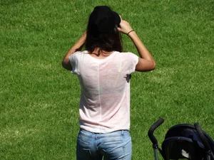 Skinny milf in tight jeans showing a bit of ass crack