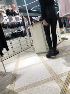 Shop Assistant's Flat Booty in Leather Shorts And Legs in Black Pantyhose Store Creepshots Gallery