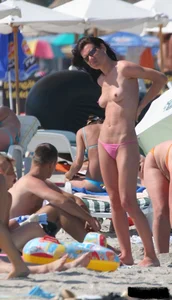 A bunch of sexy beach voyeur babes in bikinis, thongs and topless