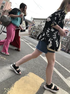 Hot pale legs of a candid girl crossing the street