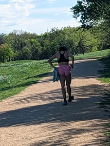 Fit asian chick running in tight pink shorts