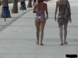 Bunch of sexy babes at the beach in thong bikinis